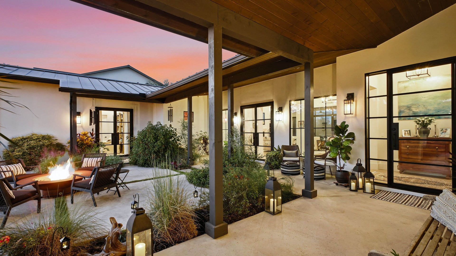 Outdoor courtyard with fire pit at sunset in The Canyons at Scenic Loop